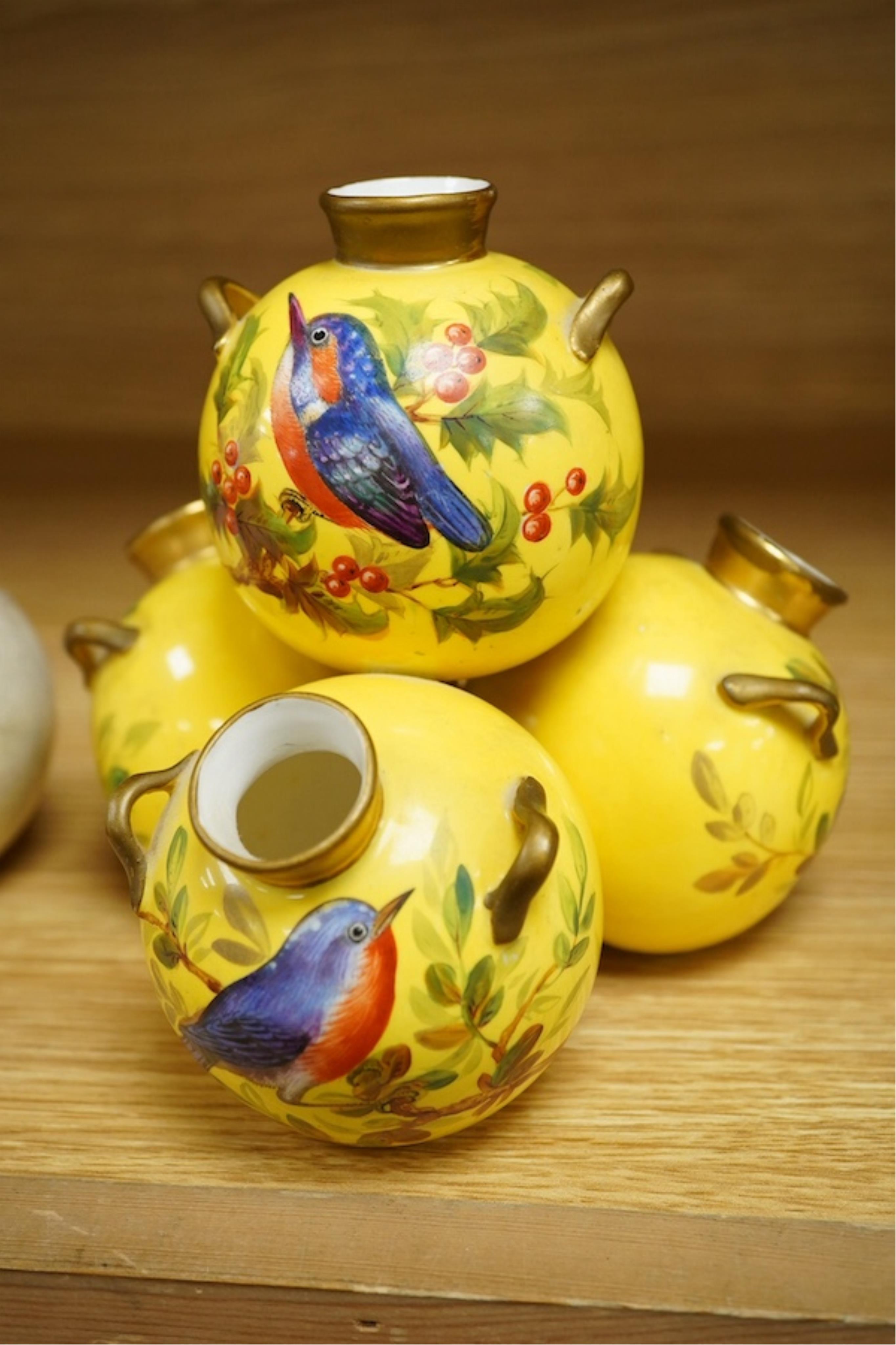 Three Royal Worcester 'pyramid' vases, painted with birds, 14cm high. Condition - fair/good